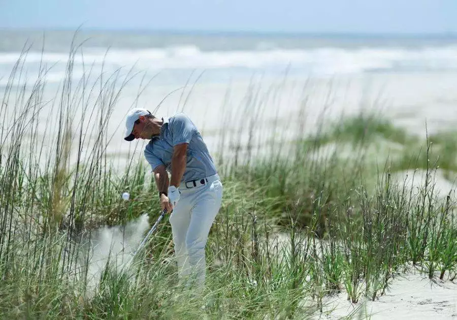 Rory McIlroy hitting from sand